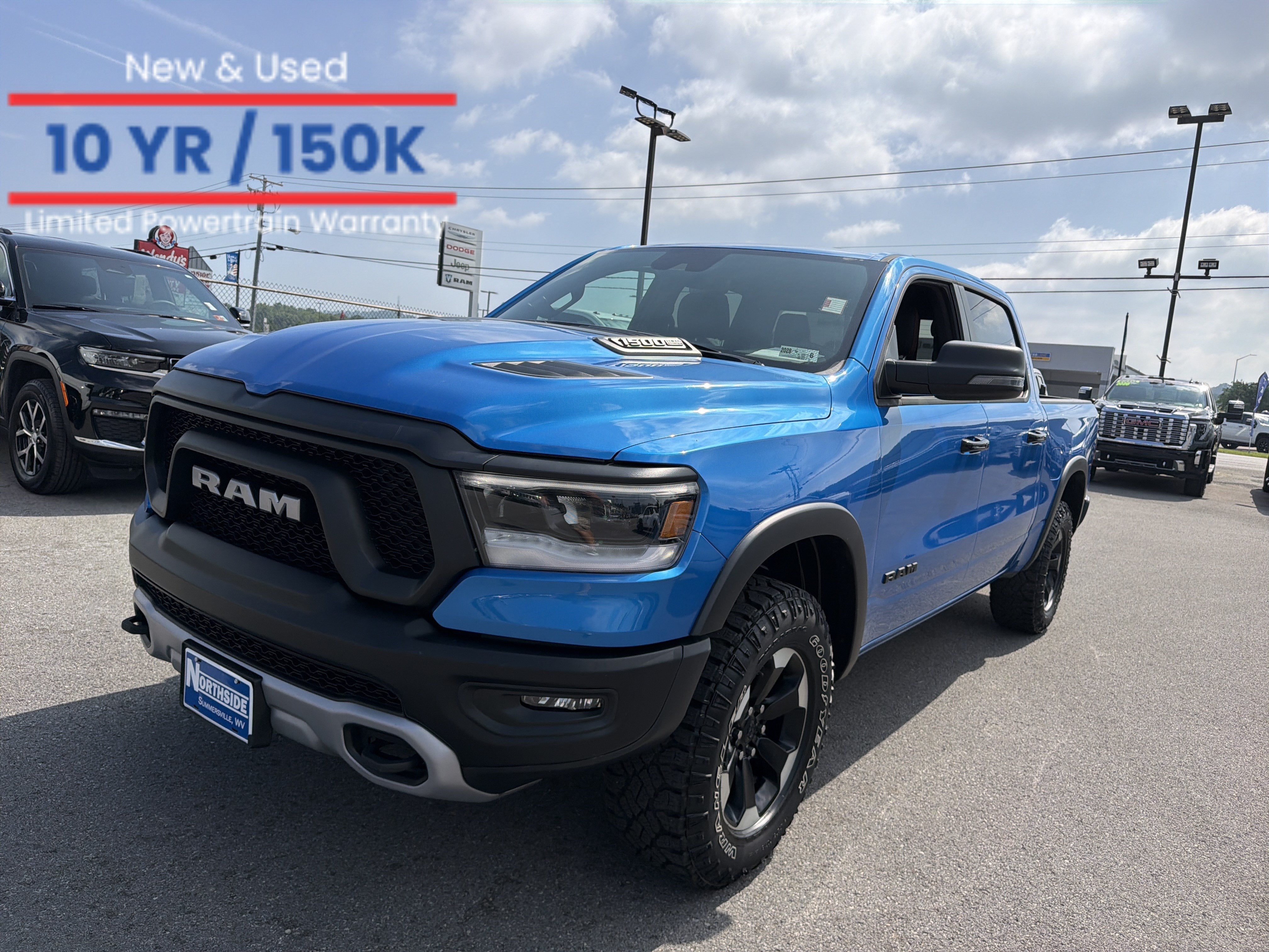 2024 RAM 1500 Rebel in Hydro Blue Pearlc — front three-quarter view
