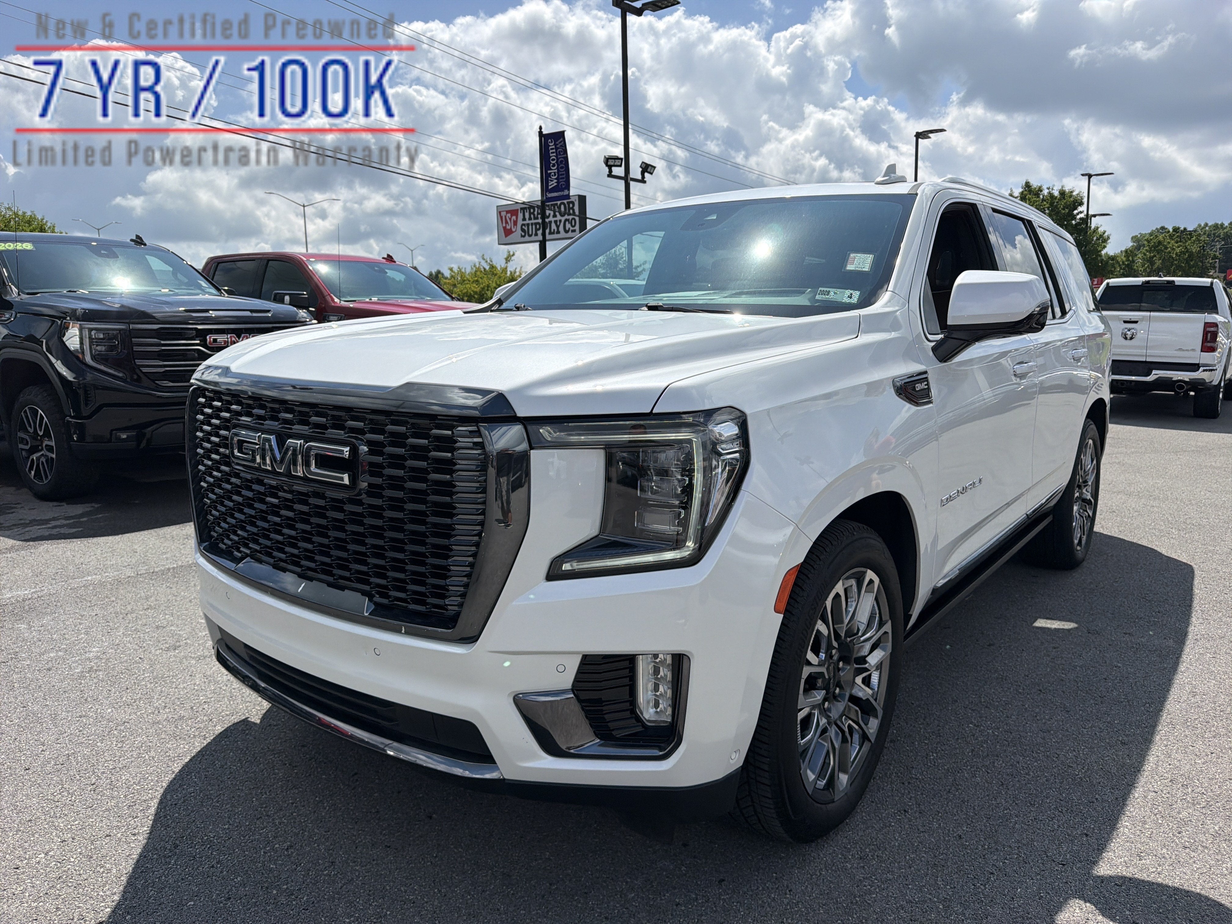 2024 GMC Yukon Denali Ultimate in White Frost Tricoat — front three-quarter view
