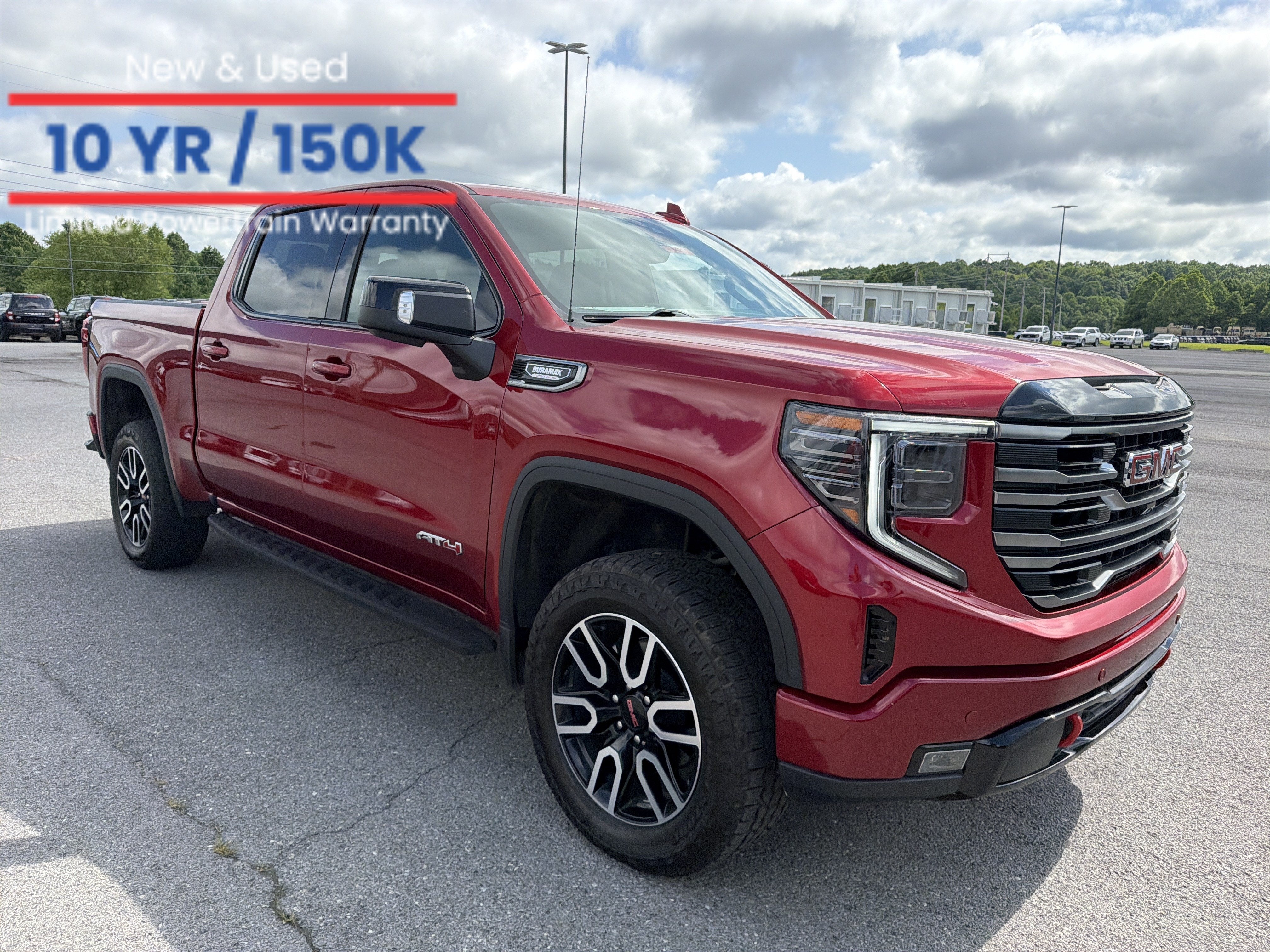 2026 GMC Sierra 1500 AT4 in Volcanic Red Tintcoat — front three-quarter view