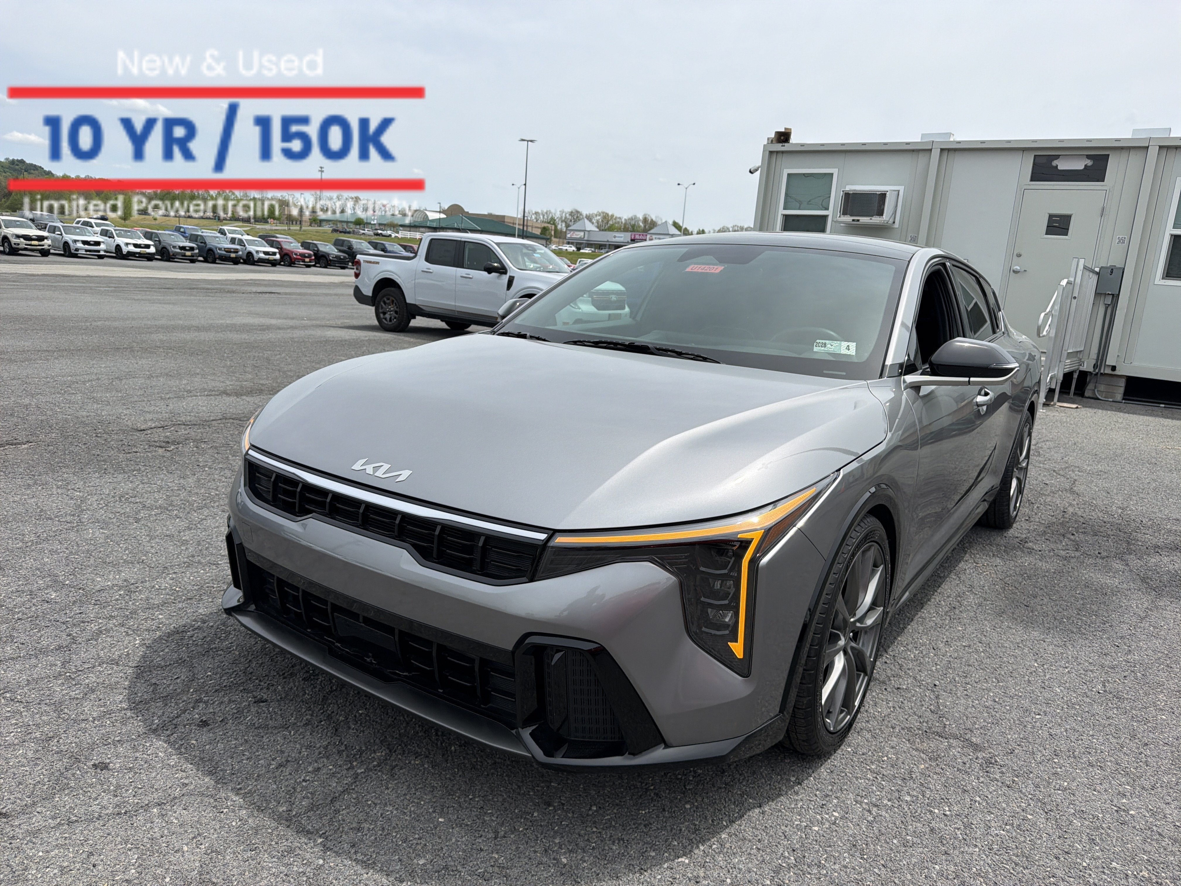 2025 Kia K4 GT-Line in Steel Gray — front three-quarter view